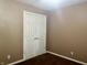 Spare bedroom with neutral paint, carpet, and a closet with double doors at 108 Meadowview Dr, Mooresville, IN 46158
