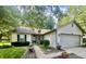 Well-manicured front yard with attractive landscaping and a concrete driveway at 108 Meadowview Dr, Mooresville, IN 46158