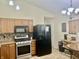 Kitchen with tile floors, modern appliances, and shaker cabinets at 108 Meadowview Dr, Mooresville, IN 46158