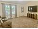 Cozy living room with plush carpeting, neutral walls, and a bright, airy feel at 108 Meadowview Dr, Mooresville, IN 46158