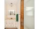 Well-lit bathroom with a vanity, mirror, and shower, complete with modern fixtures at 1111 Pendle Hill Ave, Pendleton, IN 46064