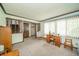 Inviting living room featuring wood trim, large windows, and a comfortable seating area at 1111 Pendle Hill Ave, Pendleton, IN 46064