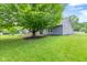 This spacious backyard is surrounded by mature trees and a well-kept lawn, creating a serene and private outdoor setting at 11218 Baycreek Dr, Indianapolis, IN 46236