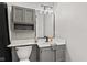 Updated bathroom featuring modern vanity, sleek fixtures, and stylish mirror with integrated lighting at 11218 Baycreek Dr, Indianapolis, IN 46236