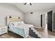 Bedroom with vaulted ceilings, luxury vinyl plank flooring, and steps for pets to get on the bed at 11218 Baycreek Dr, Indianapolis, IN 46236