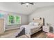Bedroom featuring a large window, vaulted ceilings, and luxury vinyl plank flooring at 11218 Baycreek Dr, Indianapolis, IN 46236