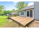 A wooden deck extends from the home, perfect for outdoor living and entertaining, with views of the spacious backyard at 11218 Baycreek Dr, Indianapolis, IN 46236
