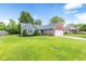 Attractive home with green lawn, beautiful landscaping, brick, and two-car garage at 11218 Baycreek Dr, Indianapolis, IN 46236