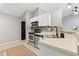 Bright kitchen with stainless appliances, tiled flooring, and a breakfast bar at 11218 Baycreek Dr, Indianapolis, IN 46236