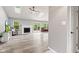 Living room featuring a fireplace, wood floors, and sliding glass doors to the deck at 11218 Baycreek Dr, Indianapolis, IN 46236