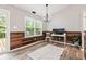 Office space boasting a wood accent wall, natural light from windows, and modern decor at 11218 Baycreek Dr, Indianapolis, IN 46236