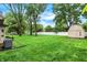 Expansive backyard with a tool shed and privacy fence at 116 Bennington Rd, Indianapolis, IN 46227