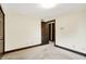 Bedroom with carpet, base trim, and an ensuite bathroom at 116 Bennington Rd, Indianapolis, IN 46227