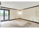 Bedroom featuring sliding glass doors, carpet floors, and ceiling trim at 116 Bennington Rd, Indianapolis, IN 46227