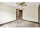 Carpeted bedroom with ceiling fan, two closets, base trim, and neutral-toned walls at 116 Bennington Rd, Indianapolis, IN 46227