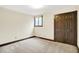Bedroom with carpet flooring, natural light from window, and large closet at 116 Bennington Rd, Indianapolis, IN 46227
