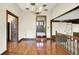 Well-lit dining area with hardwood floors offers seamless transition to other living spaces and ample room at 116 Bennington Rd, Indianapolis, IN 46227