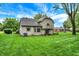 Charming home with siding and a stone foundation, enhanced by a spacious backyard at 116 Bennington Rd, Indianapolis, IN 46227