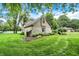 Charming home featuring stone facade, shake siding, well maintained lawn, and lush trees at 116 Bennington Rd, Indianapolis, IN 46227