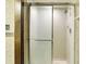 Shower with sliding glass door and chrome shower head, next to an old-fashioned towel rack at 116 Bennington Rd, Indianapolis, IN 46227