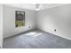 Comfortable carpeted bedroom, bright window with natural light, and neutral paint at 11722 Hartland Dr, Indianapolis, IN 46229