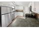 Efficient kitchen with stainless steel appliances, white cabinets, and ample counter space at 11722 Hartland Dr, Indianapolis, IN 46229
