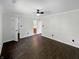 Bright and spacious main bedroom with wood-look flooring and ensuite bathroom at 11722 Hartland Dr, Indianapolis, IN 46229