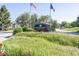Sand Creek Woods community entrance with lush landscaping and signage at 11830 Sand Creek Blvd, Fishers, IN 46037