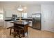 Spacious kitchen featuring stainless steel appliances, granite countertops, and a wooden island with seating at 11830 Sand Creek Blvd, Fishers, IN 46037