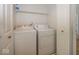 Washer and dryer nestled in a dedicated laundry room, adding convenience to household chores at 11830 Sand Creek Blvd, Fishers, IN 46037