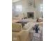 Bright living room features stylish furniture, a cozy fireplace, and neutral tones at 11830 Sand Creek Blvd, Fishers, IN 46037
