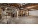Unfinished basement showcasing exposed beams and concrete floors, offering potential for customization at 1229 Helford Ln, Carmel, IN 46032