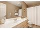 Well-lit bathroom featuring a single sink vanity with a mirror and white shower curtain at 1229 Helford Ln, Carmel, IN 46032