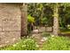 Charming deck with a grill and outdoor seating, nestled amidst trees and vibrant flowers at 1229 Helford Ln, Carmel, IN 46032