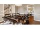 Well-lit dining room next to staircase and open to kitchen, designed for easy entertaining and Gathering gatherings at 1229 Helford Ln, Carmel, IN 46032