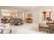Open-concept living room showcases seamless flow to kitchen and sitting room, designed for modern living at 1229 Helford Ln, Carmel, IN 46032