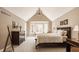 Inviting main bedroom with bay window, vaulted ceiling, and elegant furnishings, providing a relaxing atmosphere at 1229 Helford Ln, Carmel, IN 46032