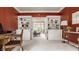 Office space with built-in shelves and french doors leading to a bright sitting room, great for working from home at 1229 Helford Ln, Carmel, IN 46032