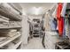 Well-organized walk-in closet featuring shelving on both sides for ample storage at 1229 Helford Ln, Carmel, IN 46032