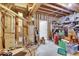 View of the unfinished basement with utilities, shelving, and storage space at 12679 Chargers Ct, Fishers, IN 46037