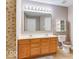 Bathroom with double sink vanity, decorative tile accents, and modern lighting at 12679 Chargers Ct, Fishers, IN 46037