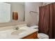 Bathroom featuring a single sink vanity, a toilet, and a shower with curtain rod at 12679 Chargers Ct, Fishers, IN 46037