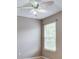 Small bedroom with a window and a ceiling fan and light fixture at 12679 Chargers Ct, Fishers, IN 46037