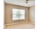 Neutral bedroom featuring a large window providing natural light and plush carpet flooring at 12679 Chargers Ct, Fishers, IN 46037