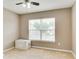 Bedroom with a window providing natural light, a ceiling fan, and plush carpet flooring at 12679 Chargers Ct, Fishers, IN 46037