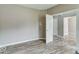 Open flex room with wood floors, neutral paint and doorways to customize to your needs at 12679 Chargers Ct, Fishers, IN 46037