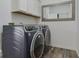 Laundry room with modern appliances and stylish mirror at 12679 Chargers Ct, Fishers, IN 46037