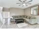 Comfortable living room with a large sectional sofa, neutral walls, and wood flooring at 12679 Chargers Ct, Fishers, IN 46037