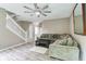 Spacious living room featuring a cozy sectional sofa and a ceiling fan at 12679 Chargers Ct, Fishers, IN 46037