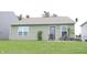 Charming backyard featuring a patio with wicker furniture and lush green grass at 12901 N Collett Way, Camby, IN 46113